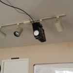 Projector with track lighting mount